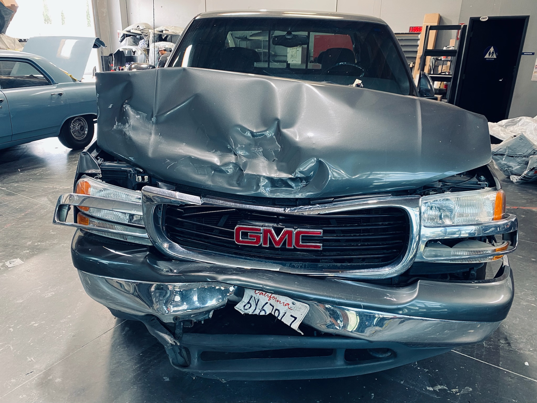 Real collision damage on a customer vehicle at Santee Auto Body