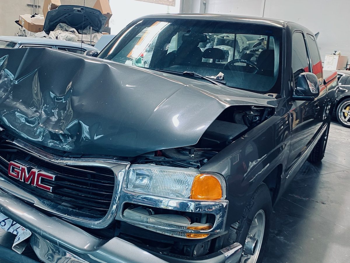 Collision-damaged truck intake at BumperDoc Santee